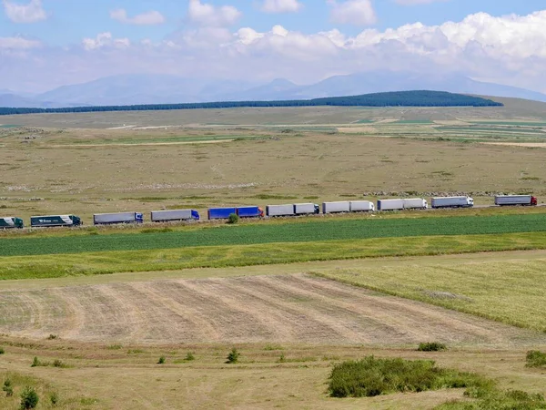 Line of trucks before Turkish border in Samtskhe-Javakheti National Park, Georgia. High quality photo