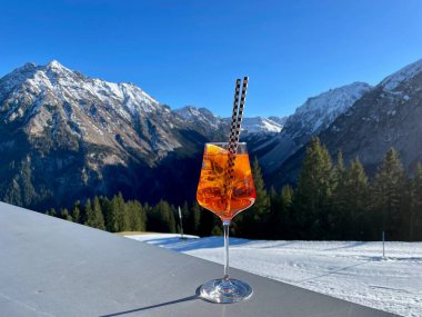 Apres-ski cocktail, after ski, in Austrian Alps. Vorarlberg, Austria. High quality photo