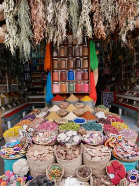 Beautifully arranged herbs and spices in barrels and baskets in the souk of Marrakech, Morocco. High quality photo