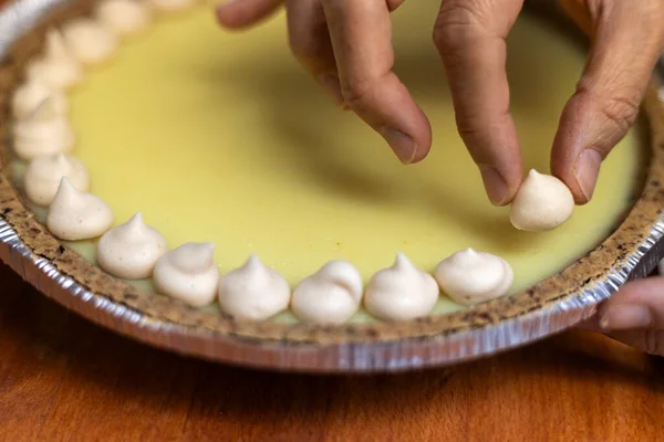 Vegan lemon pie garnished with meringue