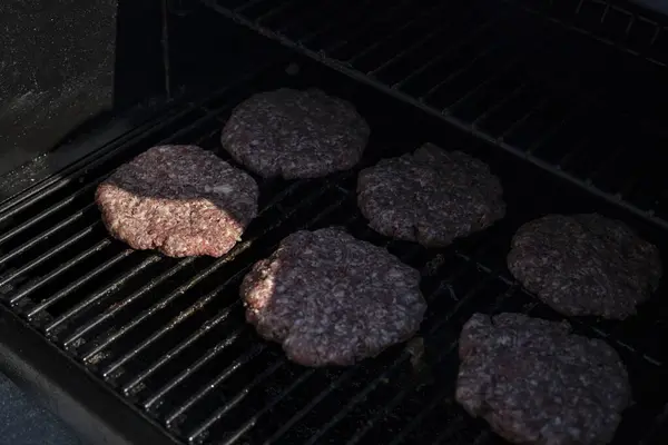 patty beef burgers cooked on Grill and smoker