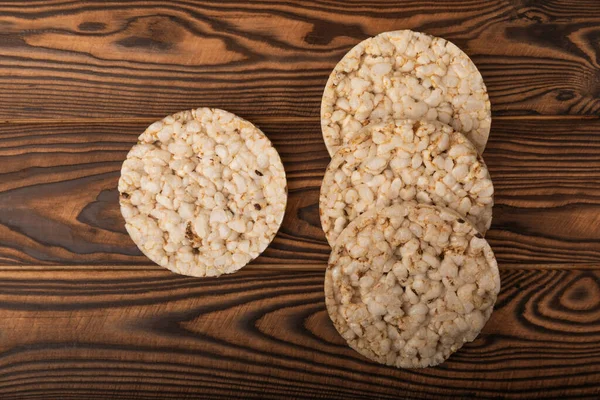 Round rice cakes on brown table. Crispbread.Puffed rice bread. diet crispy round rice cakes.Place for text. Place for copy. Healthy food. dietary product.