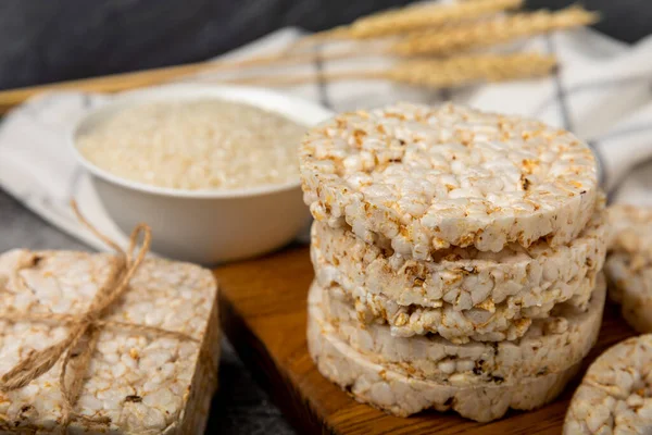 Rice cakes on a black table. Bread. Airy rice bread. dietary crispy round rice cakes. Place for text. Place to copy. Healthy food. dietary product.