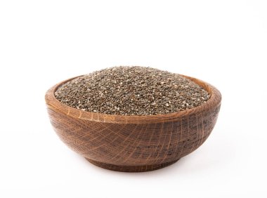 Beyaz arka planda izole edilmiş kabın içindeki chia tohumları. süper yemek