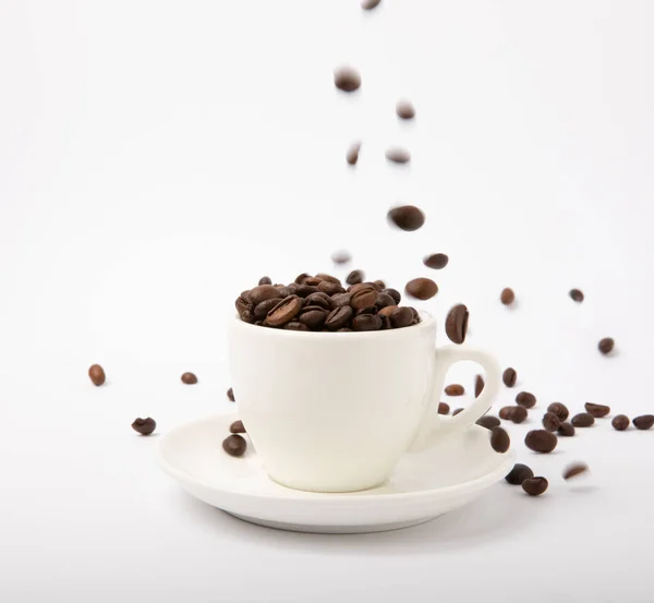 Coffee beans in a coffee cup isolated on white background. Place for copy space. Place for text. MOCAP