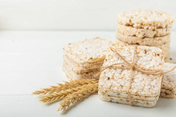 Rice cakes on a white texture background. Bread. Airy rice bread. dietary crispy round rice cakes. Place for text. Place to copy. Healthy food. dietary product.