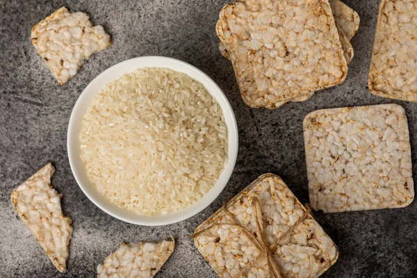 Rice cakes on a black table. Bread. Airy rice bread. dietary crispy round rice cakes. Place for text. Place to copy. Healthy food. dietary product.