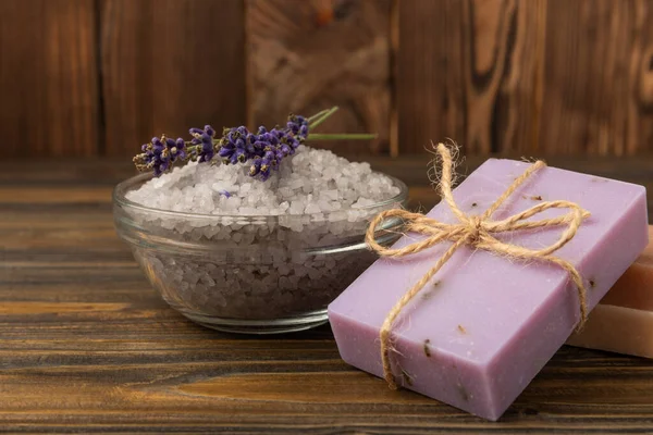 spa lavender. Sea salt and handmade soap on brown texture background. Natural cosmetics on herbs with lavender flowers. Relak and relaxation. Aromatherapy. beauty concept