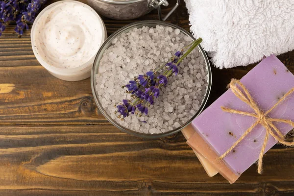 spa lavender. Sea salt and handmade soap on brown texture background. Natural cosmetics on herbs with lavender flowers. Relak and relaxation. Aromatherapy. beauty concept