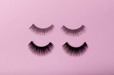 False eyelashes on a lilac background close-up. Makeup. Beauty concept.