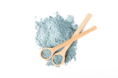 Blue spirulina powder in spoon isolated on white background. Natural vegan superfood. food supplement.