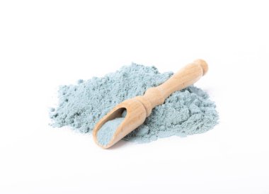 Blue spirulina powder in spoon isolated on white background. Natural vegan superfood. food supplement.