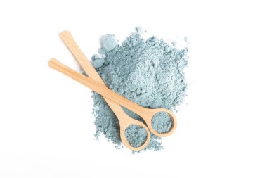 Blue spirulina powder in spoon isolated on white background. Natural vegan superfood. food supplement.