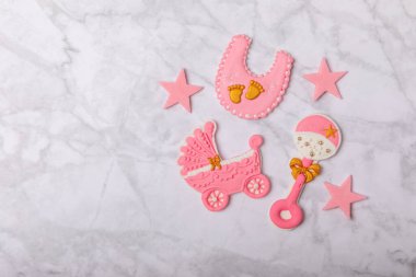 Set of delicious baby shower cookies on a white marble background. Gender cookies.Baby shower party. Close-up. Flat lay. Place for text.