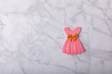 Set of delicious baby shower cookies on a white marble background. Gender cookies.Baby shower party. Close-up. Flat lay. Place for text.