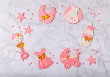 Set of delicious baby shower cookies on a white marble background. Gender cookies.Baby shower party. Close-up. Flat lay. Place for text.