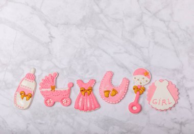 Set of delicious baby shower cookies on a white marble background. Gender cookies.Baby shower party. Close-up. Flat lay. Place for text.