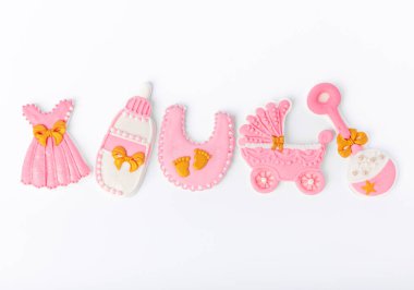 Set of delicious baby shower cookies isolated on white background.