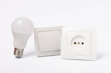 LED lamp, Wall light switch and socket isolated on white background. MOKAP.Electric concept.