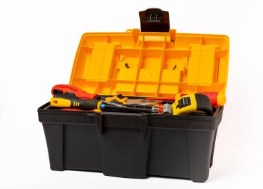 Toolbox isolated on white background.Box with electrician's tools. Multimeter, construction tape, electrical tape, screwdrivers, pliers and an automatic insulation stripper.