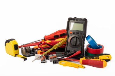 Electrician tools isolated on white background.Electrician tools set. Multimeter, construction tape, electrical tape, screwdrivers, pliers and an automatic insulation stripper.