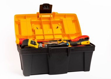 Toolbox isolated on white background.Box with electrician's tools. Multimeter, construction tape, electrical tape, screwdrivers, pliers and an automatic insulation stripper.