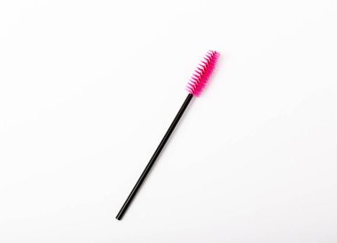 Mascara brushes, makeup brushes, applicators isolated on white background. Close-up. Brushes for eyelash extensions.