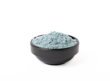 Blue spirulina powder in bowls isolated on white background. Natural vegan superfood. Food supplement. Phycocyanin extract.