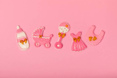 Baby shower cookies on a pink background. Delicious cookies for a baby party. Baby shower party concept. Flat lay. View from above. candy bar. Gender party.