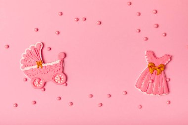 Baby shower cookies on a pink background. Delicious cookies for a baby party. Baby shower party concept. Flat lay. View from above. candy bar. Gender party.
