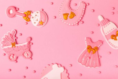 Baby shower cookies on a pink background. Delicious cookies for a baby party. Baby shower party concept. Flat lay. View from above. candy bar. Gender party.
