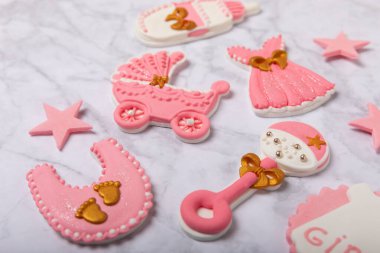 Baby shower cookies on a white marble background. Delicious cookies for a baby party. Baby shower party concept. Flat lay. View from above. candy bar