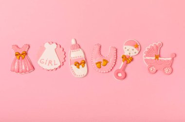 IT'S A GIRL! Baby shower cookies on a bright pink background. Gender cookies. Candy bar holiday baby shower party. Gender party. Holiday concept.