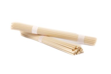 Dried raw rice noodles isolated on white background.