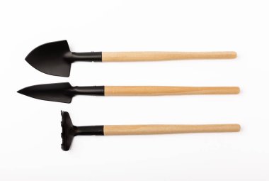 Garden shovel and fork, garden rake isolated on white background. Gardening Tools.