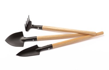 Garden shovel and fork, garden rake isolated on white background. Gardening Tools.