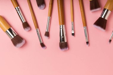 Beauty cosmetics makeup brushes. Collection of cosmetic makeup brushes. Banner. Fashion woman makes up brushes. Creative fashion concept. Place for text. Flat lay. MOCAP.