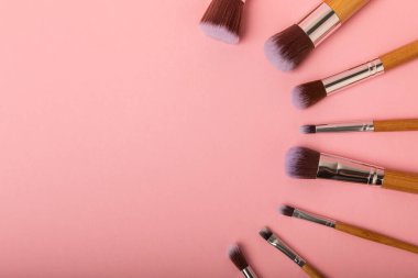 Beauty cosmetics makeup brushes. Collection of cosmetic makeup brushes. Banner. Fashion woman makes up brushes. Creative fashion concept. Place for text. Flat lay. MOCAP.