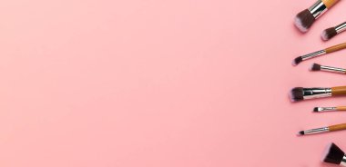 Beauty cosmetics makeup brushes. Collection of cosmetic makeup brushes. Banner. Fashion woman makes up brushes. Creative fashion concept. Place for text. Flat lay. MOCAP.