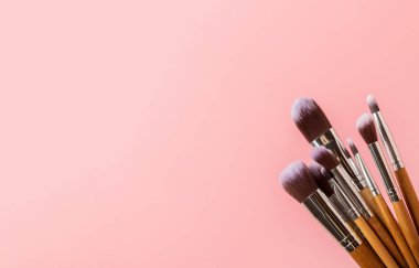 Beauty cosmetics makeup brushes. Collection of cosmetic makeup brushes. Banner. Fashion woman makes up brushes. Creative fashion concept. Place for text. Flat lay. MOCAP.