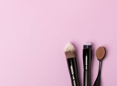 Beauty cosmetics makeup brushes. Collection of cosmetic makeup brushes. Banner. Fashion woman makes up brushes. Creative fashion concept. Place for text. Flat lay. MOCAP.