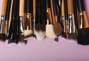 Beauty cosmetics makeup brushes. Collection of cosmetic makeup brushes. Banner. Fashion woman makes up brushes. Creative fashion concept. Place for text. Flat lay. MOCAP.