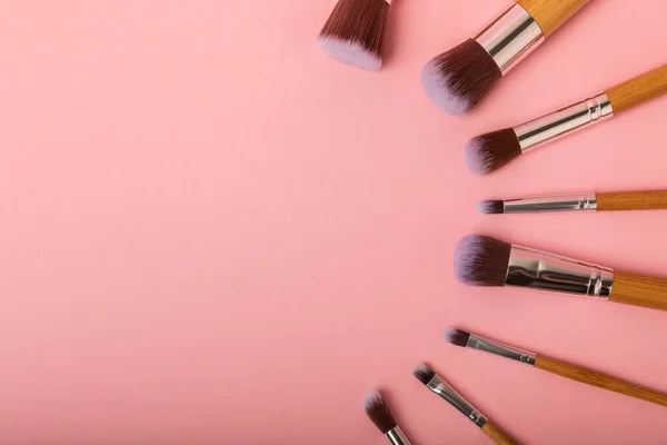 Beauty cosmetics makeup brushes. Collection of cosmetic makeup brushes. Banner. Fashion woman makes up brushes. Creative fashion concept. Place for text. Flat lay. MOCAP.
