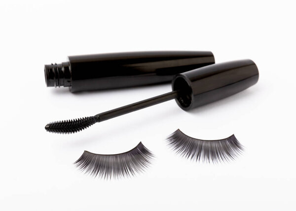 Mascara brushes and false eyelashes isolated on white background. Makeup brushes makeup kits.Disposable brush for eyelashes and eyebrows.Close-up.