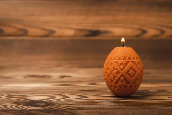 stock image Easter eggs candles on brown background.Side view. Design. Holiday concept. Happy easter.Easter holiday concept.Decor for home and festive steel.Copy space. Place for text.