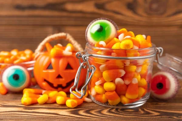 Halloween Candy Corn Jelly Eye Glass Jar Brown Background Classic — Stock Photo, Image