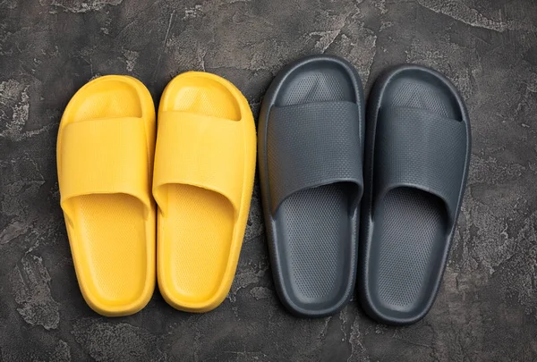 stock image Home slippers on a black marble background. Indoor shoes. Flatley. Home cozy slippers for comfort. Close-up. Place for text. Copy space.