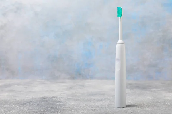 Electric Toothbrush Cement Background Smart Electric Toothbrush Charged Power Bank — Stock Photo, Image