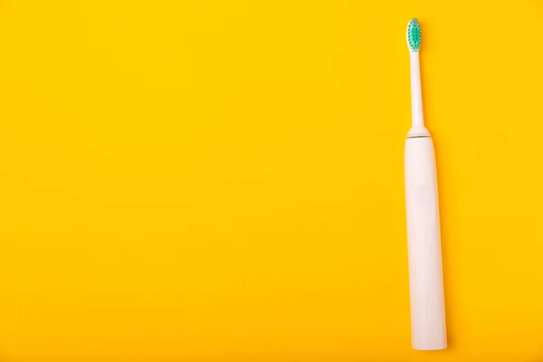 Sonic Electric Toothbrush Toothpaste Mouthwash Dental Floss Tongue Cleaner Yellow — Stock Photo, Image