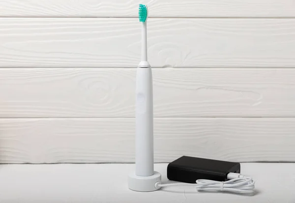 Modern Electric Toothbrush Being Charged External Power Bank Battery Marble — Stock Photo, Image